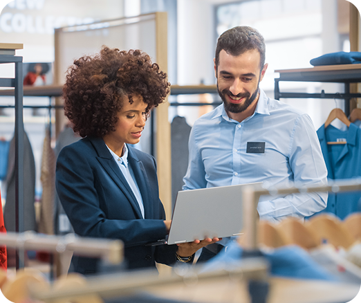 Female CPG salesperson working with a retail store associate
